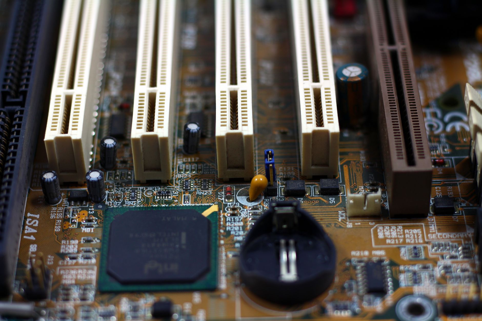 Close-up of a circuit board showing labeled electronic components.