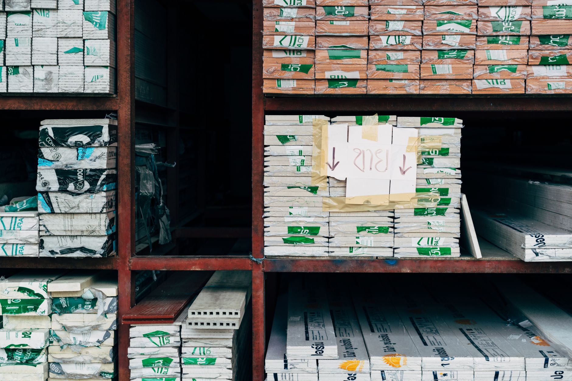 A warehouse with organized stacks of stored materials.